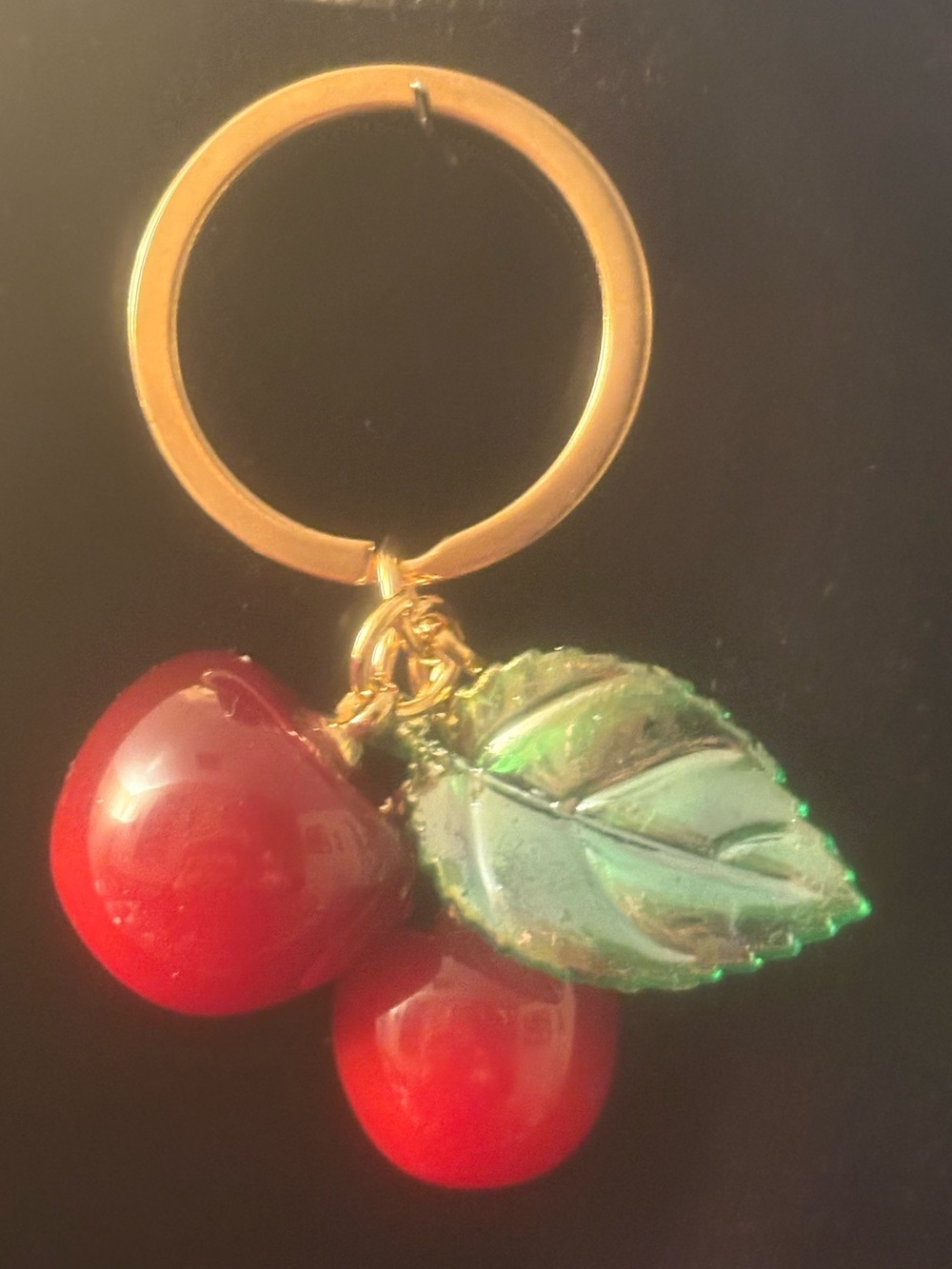 Gold Ring Keychain/purse black ng is tith Red Cherry Charms and Green Leaf Accen